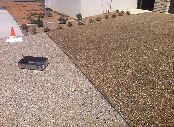 Fresh sealer applied to concrete driveway