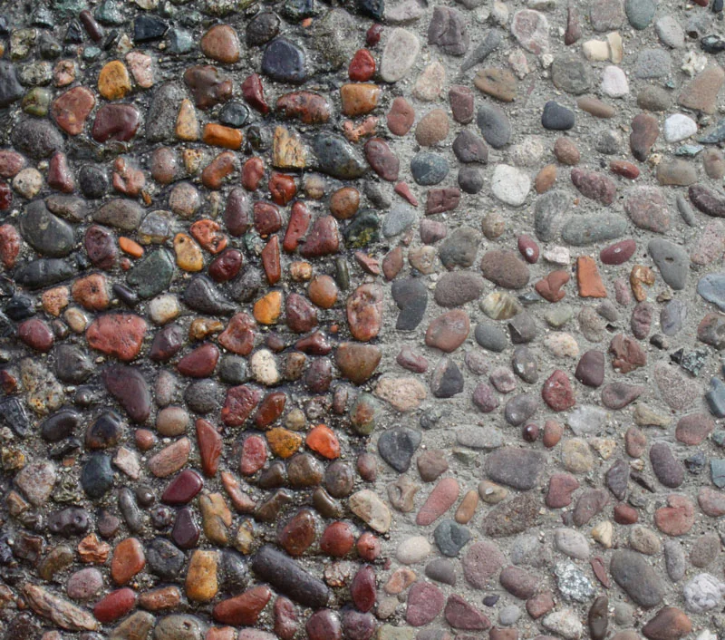 Exposed aggregate concrete before and after sealing closeup
